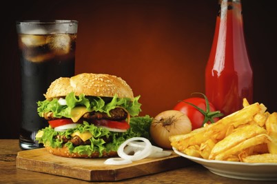 hamburger and fries on table